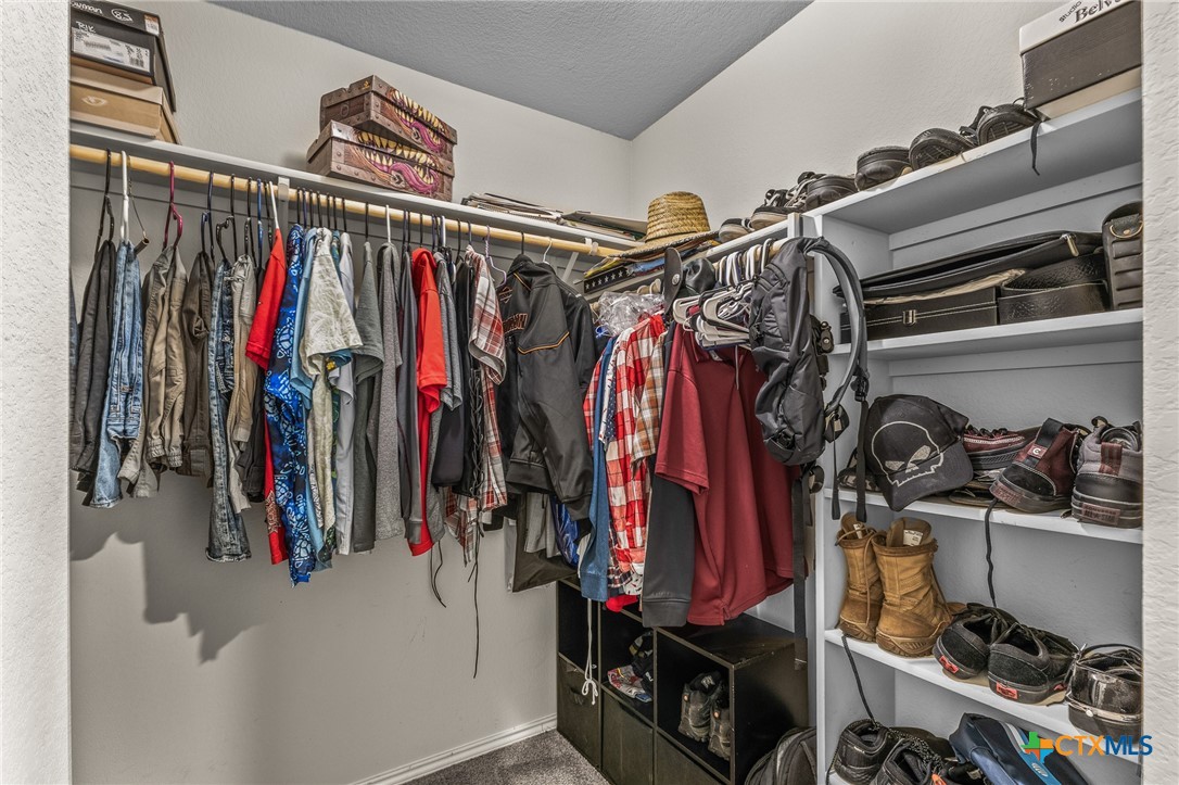1006 Rosa Parks Drive Killeen, TX 76543 - Photo 18 of 34 a view of walk in closet with clothes and shoes
