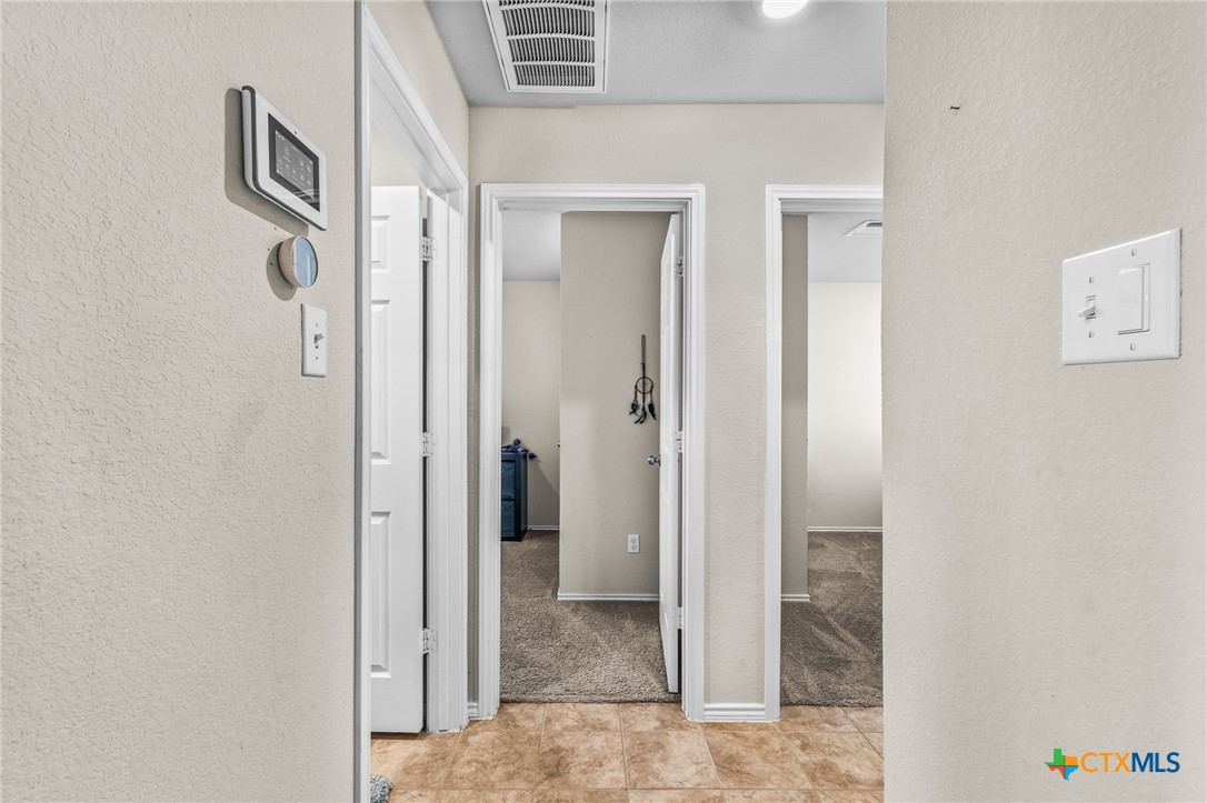 1006 Rosa Parks Drive Killeen, TX 76543 - Photo 19 of 34 a view of a hallway with wooden floor