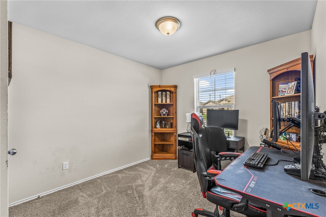 1006 Rosa Parks Drive Killeen, TX 76543 - Photo 21 of 34 a view of a workspace with furniture and a window
