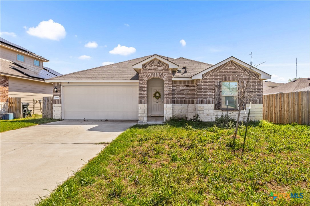 1006 Rosa Parks Drive Killeen, TX 76543 - Photo 32 of 34 a front view of a house with a garden