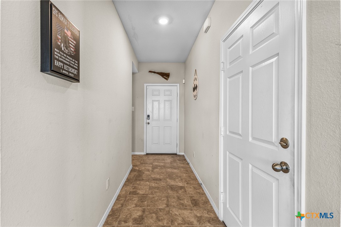 1006 Rosa Parks Drive Killeen, TX 76543 - Photo 4 of 34 a view of a hallway with wooden floor and entryway