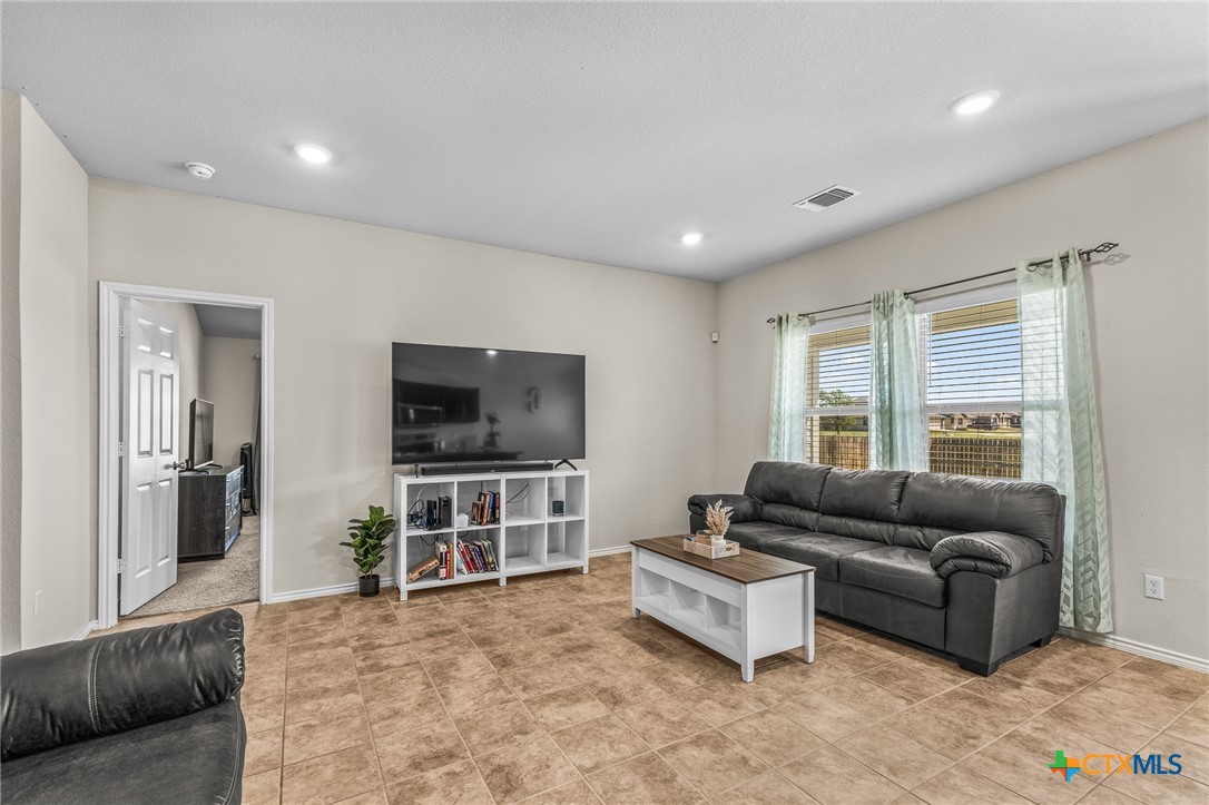 1006 Rosa Parks Drive Killeen, TX 76543 - Photo 6 of 34 a living room with furniture and a flat screen tv