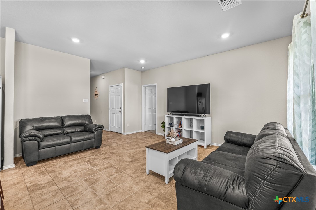 1006 Rosa Parks Drive Killeen, TX 76543 - Photo 7 of 34 a living room with furniture and a flat screen tv