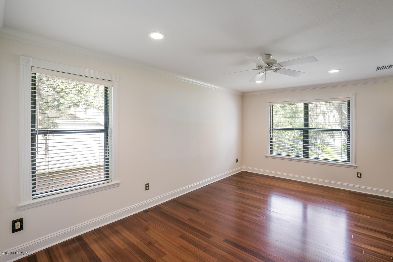3130 Nautilus Road Middleburg, FL 32068 - Photo 31 of 67 a view of an empty room with wooden floor and a window