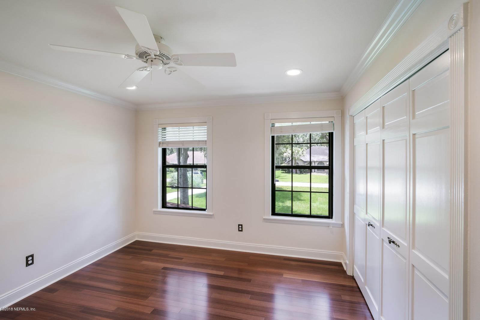 3130 Nautilus Road Middleburg, FL 32068 - Photo 36 of 67 a view of an empty room with wooden floor and a window