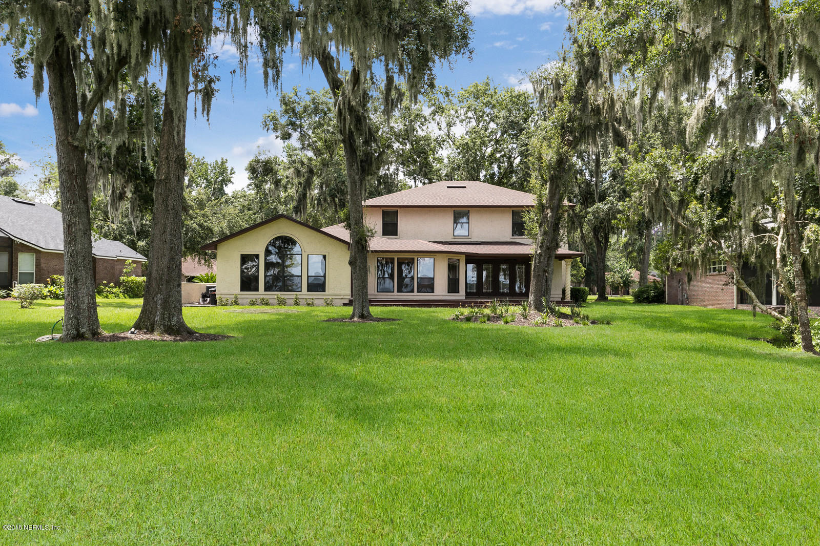 3130 Nautilus Road Middleburg, FL 32068 - Photo 44 of 67 a front view of a house with a garden