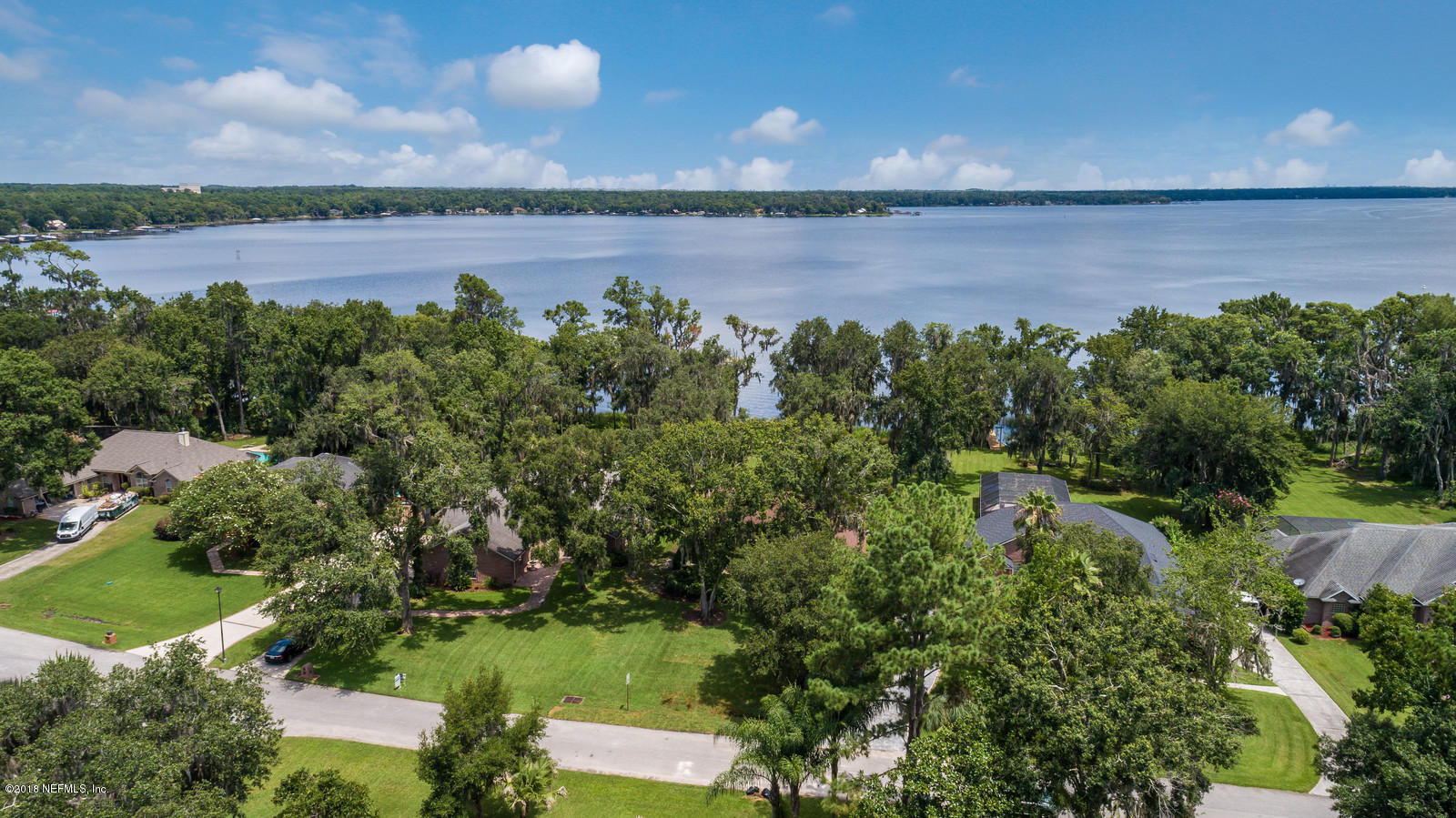 3130 Nautilus Road Middleburg, FL 32068 - Photo 54 of 67 an aerial view of a house with a yard and lake view