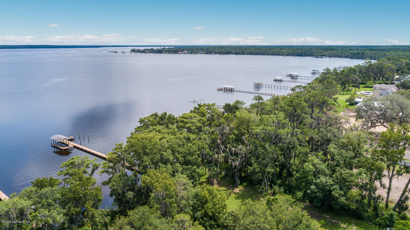 3130 Nautilus Road Middleburg, FL 32068 - Photo 65 of 67 an aerial view of a house with a yard and lake view