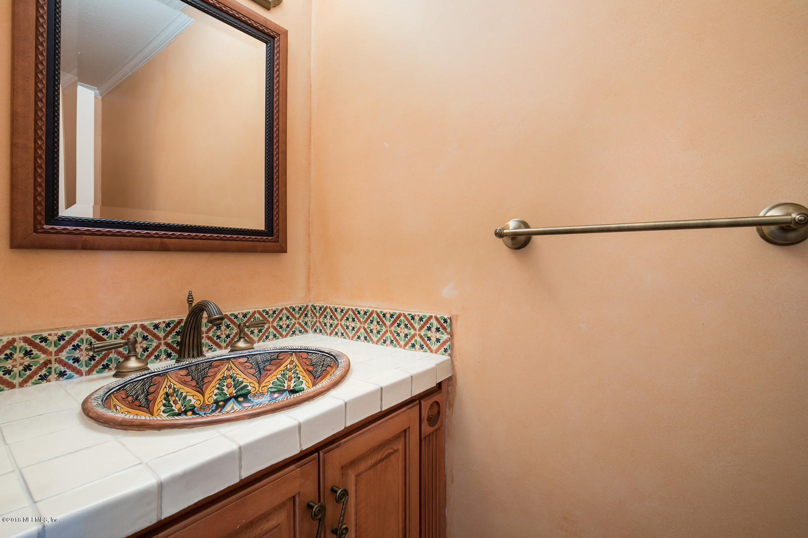 3130 Nautilus Road Middleburg, FL 32068 - Photo 9 of 67 a bathroom with a sink and a mirror