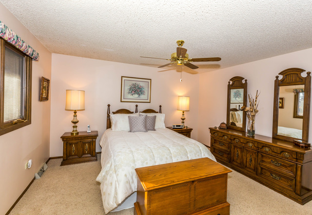 809 Overlook Drive Frankfort, IL 60423 - Photo 12 of 24 a bedroom with a bed and dresser with mirror