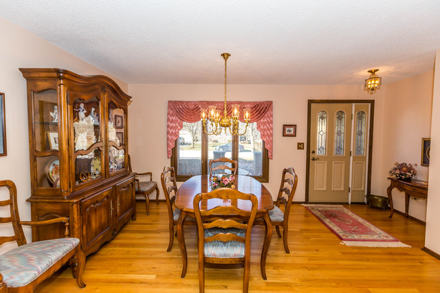 809 Overlook Drive Frankfort, IL 60423 - Photo 4 of 24 a dining room with furniture window and wooden floor