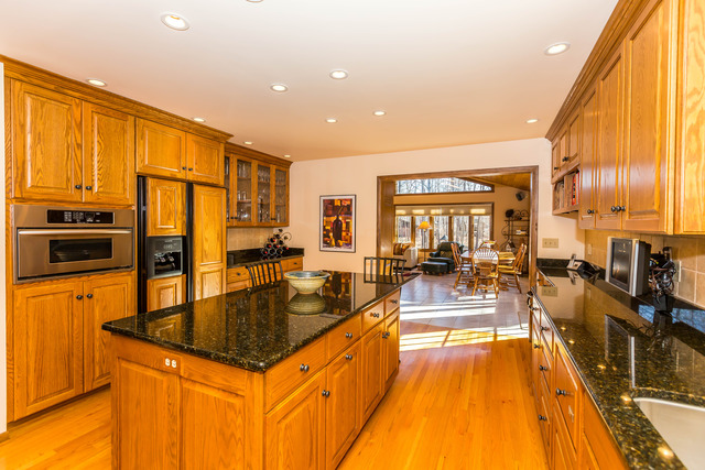 809 Overlook Drive Frankfort, IL 60423 - Photo 8 of 24 a kitchen with stainless steel appliances granite countertop a sink a stove and a refrigerator
