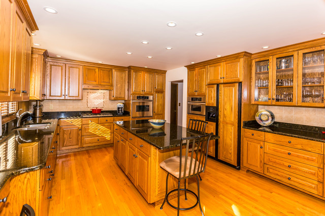 809 Overlook Drive Frankfort, IL 60423 - Photo 9 of 24 a kitchen with stainless steel appliances granite countertop a stove a sink and a refrigerator