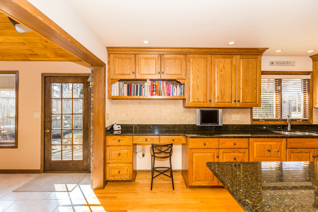 809 Overlook Drive Frankfort, IL 60423 - Photo 10 of 24 a kitchen with stainless steel appliances granite countertop a stove and a white cabinets