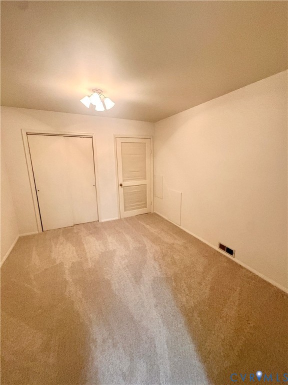 12 Snughaven Road Henrico, VA 23228 - Photo 6 of 15 Neutral-toned carpeting, white walls, and a ceilin