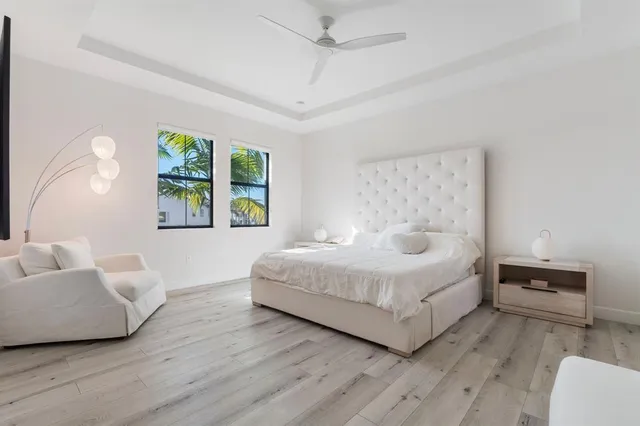 a spacious bedroom with a bed and a couch