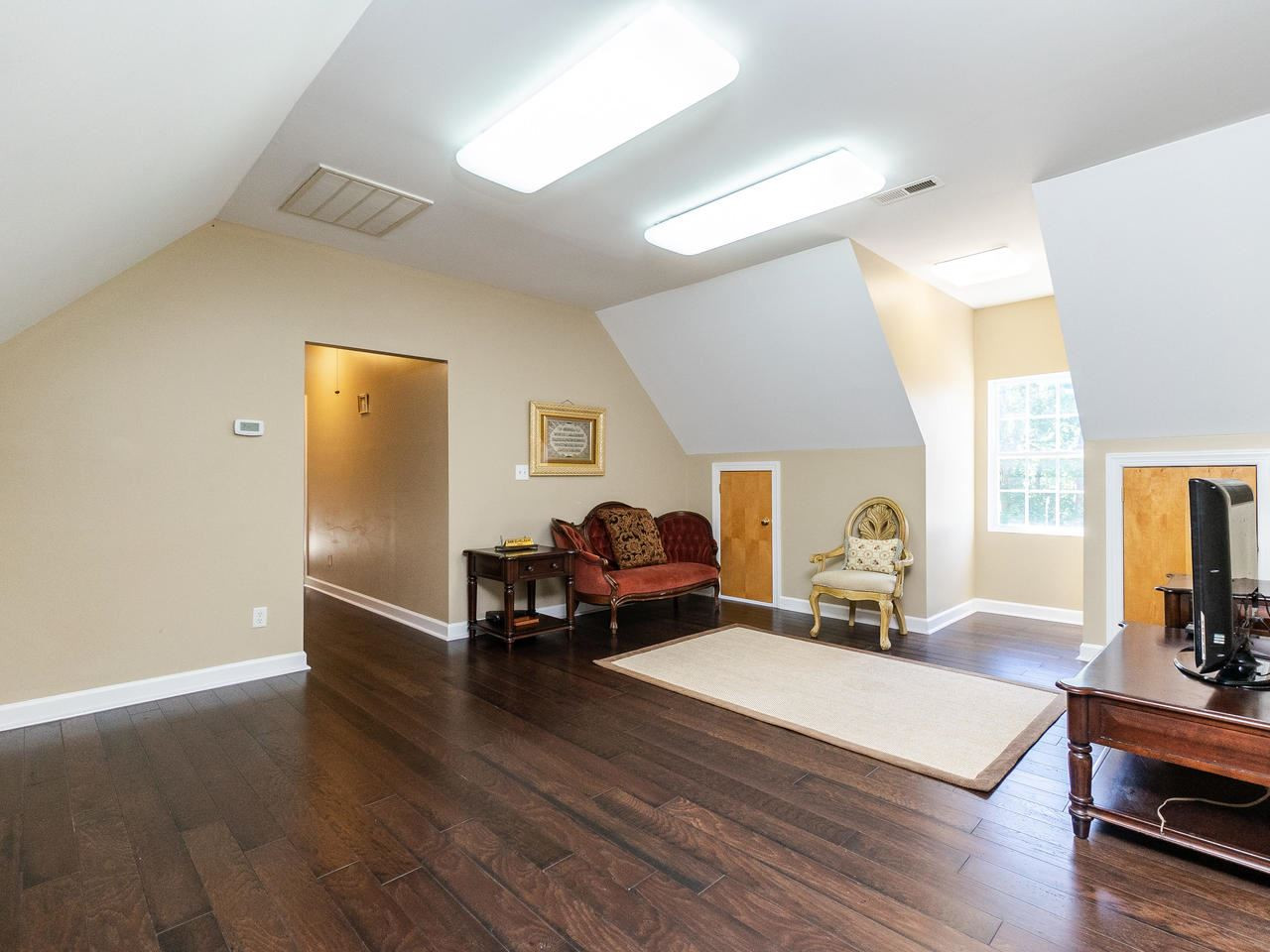 6815 Holly Springs Road Raleigh, NC 27606 - Photo 26 of 30 Living area above garage