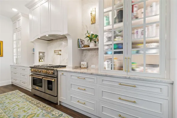 a utility room with sink dryer and washer