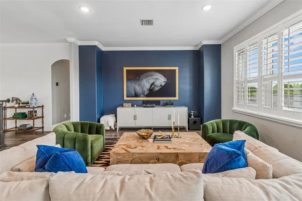 a bedroom with a bed and a couch