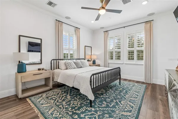 a dining room with furniture and a floor to ceiling window