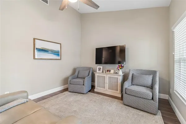 a view of a house with swimming pool and a yard