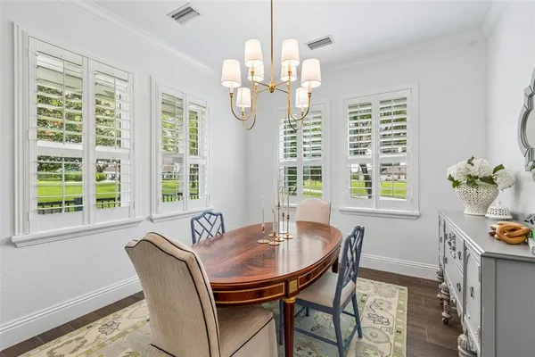 a kitchen with sink and view of living room