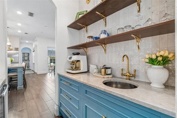 a large kitchen with a table and chairs