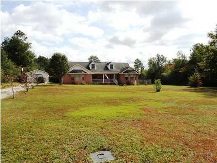 1950 Smyers Road Cantonment, FL 32533 - Photo 1 of 25 a view of a swimming pool with an outdoor seating