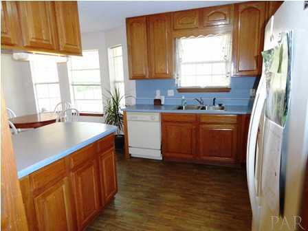 1950 Smyers Road Cantonment, FL 32533 - Photo 15 of 25 a kitchen with stainless steel appliances granite countertop a sink stove and refrigerator