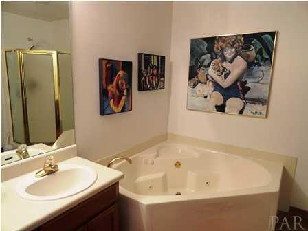 1950 Smyers Road Cantonment, FL 32533 - Photo 20 of 25 a bathroom with a bathtub and a sink