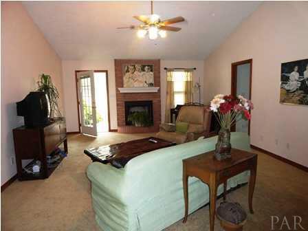 1950 Smyers Road Cantonment, FL 32533 - Photo 8 of 25 a living room with furniture and a fireplace