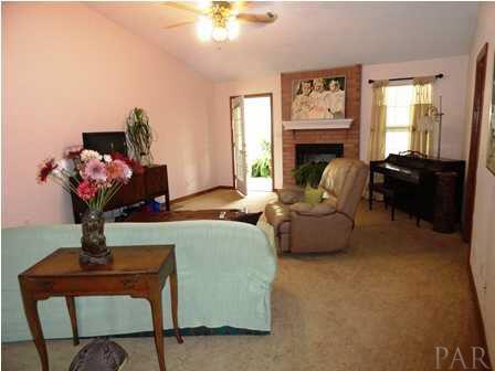 1950 Smyers Road Cantonment, FL 32533 - Photo 9 of 25 a living room with furniture flowerpot and window