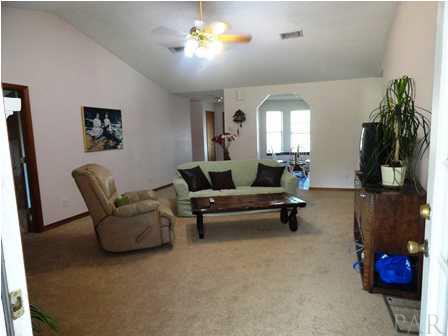 1950 Smyers Road Cantonment, FL 32533 - Photo 10 of 25 a living room with furniture and a potted plant