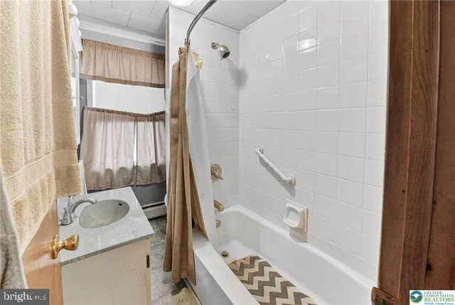 a bedroom with furniture and a gym equipment