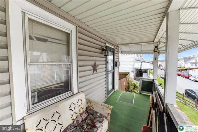 a room with window and furniture