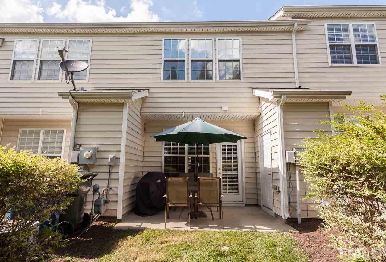 7815 Spungold Street Raleigh, NC 27617 - Photo 22 of 25 a front view of a house with patio