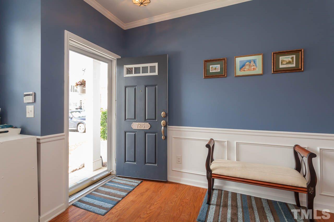7815 Spungold Street Raleigh, NC 27617 - Photo 4 of 25 a living room with furniture and a window
