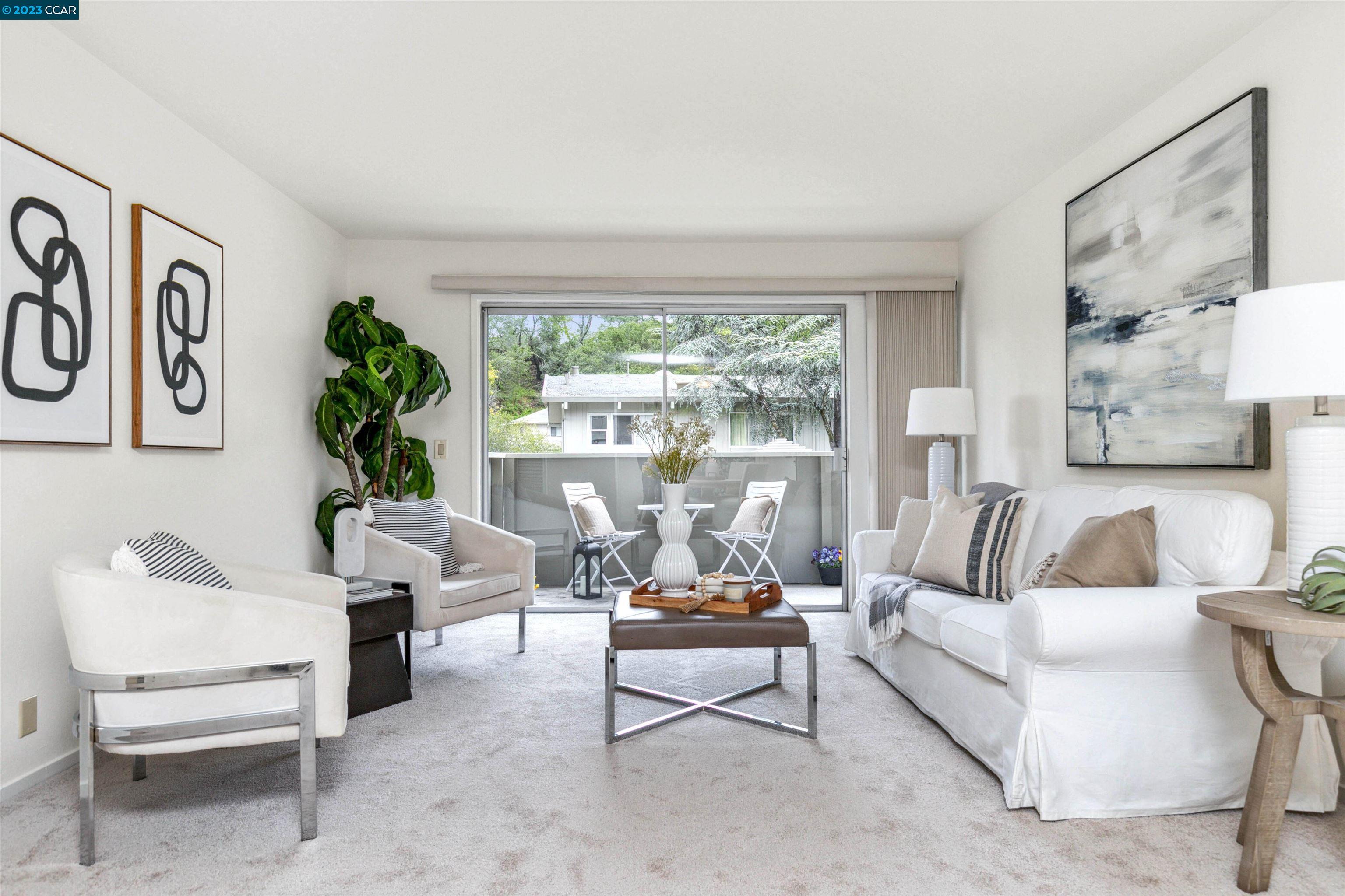 73 Brookwood Road, Unit 37 Orinda, CA 94563 - Photo 1 of 1 a living room with furniture and a large window