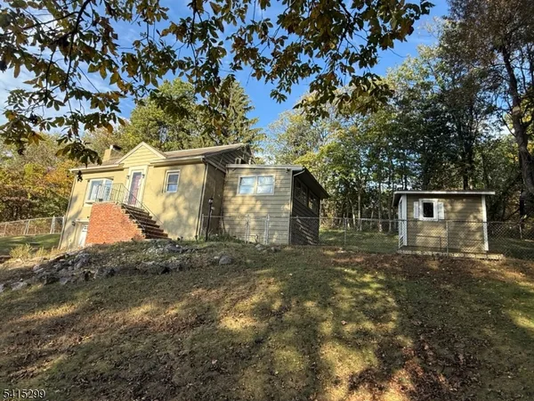front view of a house with a trees