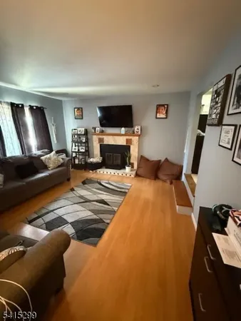 a bedroom with furniture and a flat screen tv
