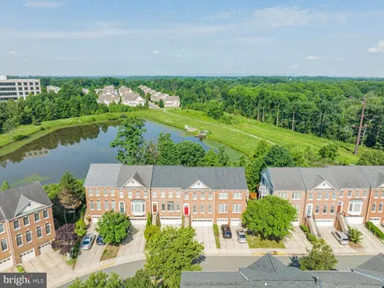 a view of front door of a house with stairs and wooden door
