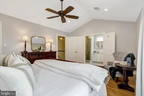 a bedroom with a bed and a table