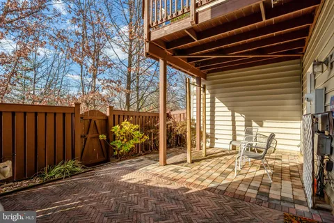 a small white building with a white roof and stairs
