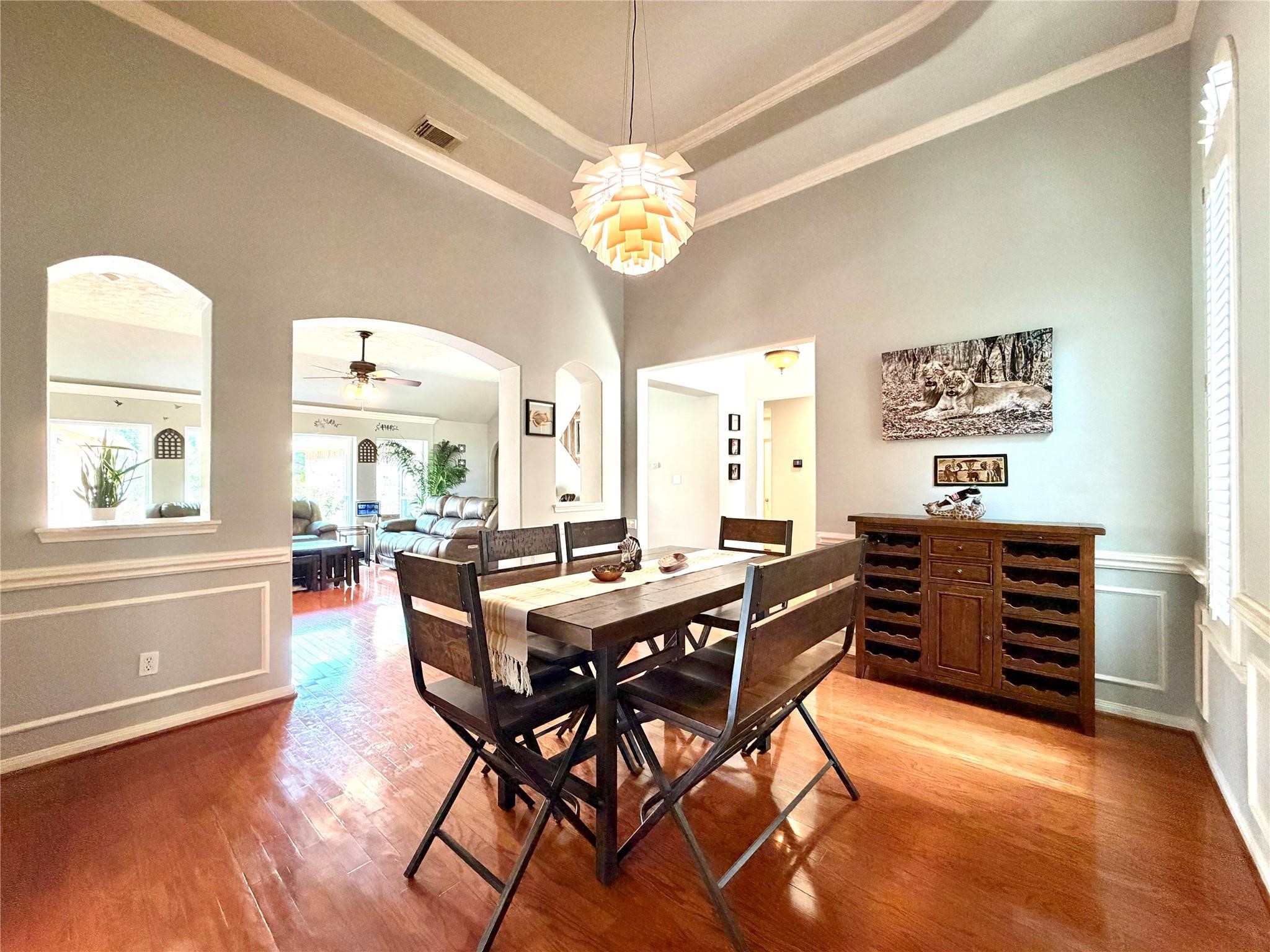 24818 Haverford Road Spring, TX 77389 - Photo 21 of 45 Large archways lead to a family room with natural light, creating an open, inviting space.