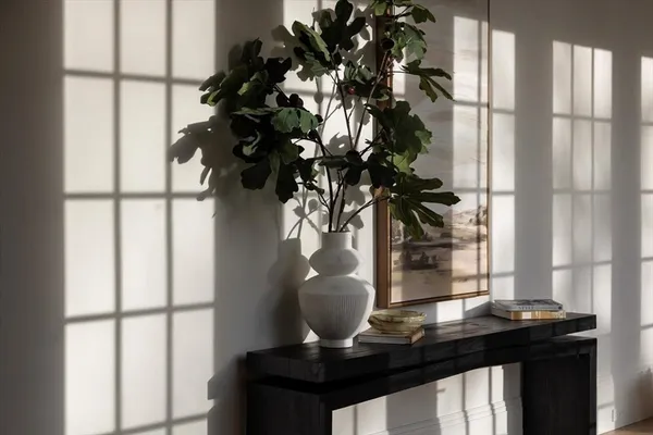 a vase of flowers sitting on a table