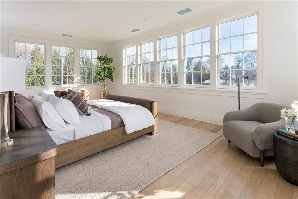 222 Warren Street Brookline, MA 02445 - Photo 17 of 33 a bedroom with bed and a large window