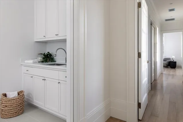 a kitchen with a refrigerator and cabinets