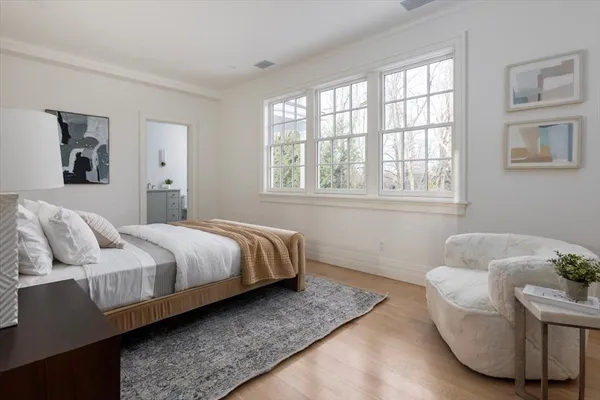 a bedroom with a bed and a couch