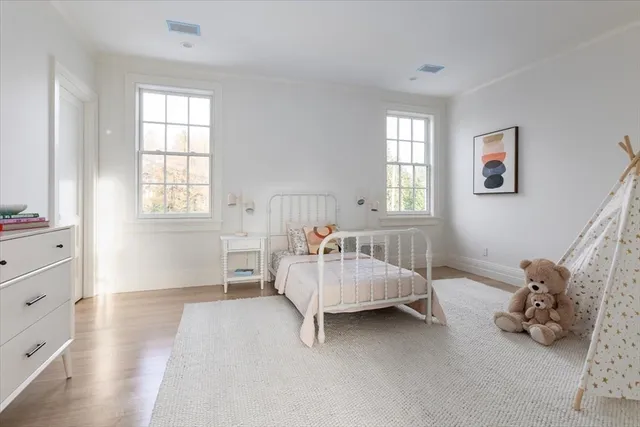 a bedroom with furniture and window