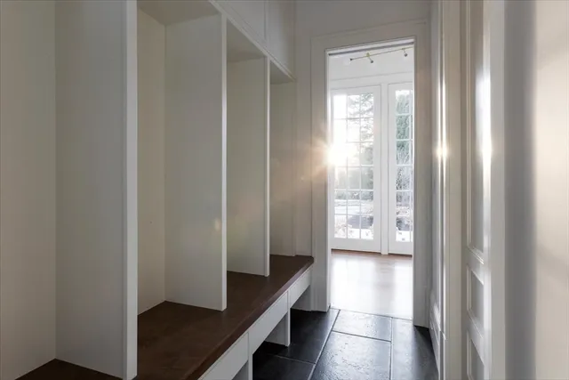 a view of a hallway with windows